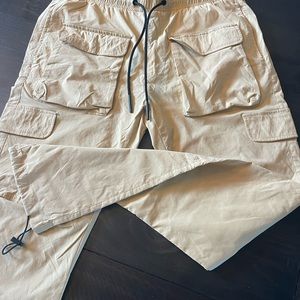 Awesome. Front pockets. Only worn once.  Beautiful color. Excellent condition.